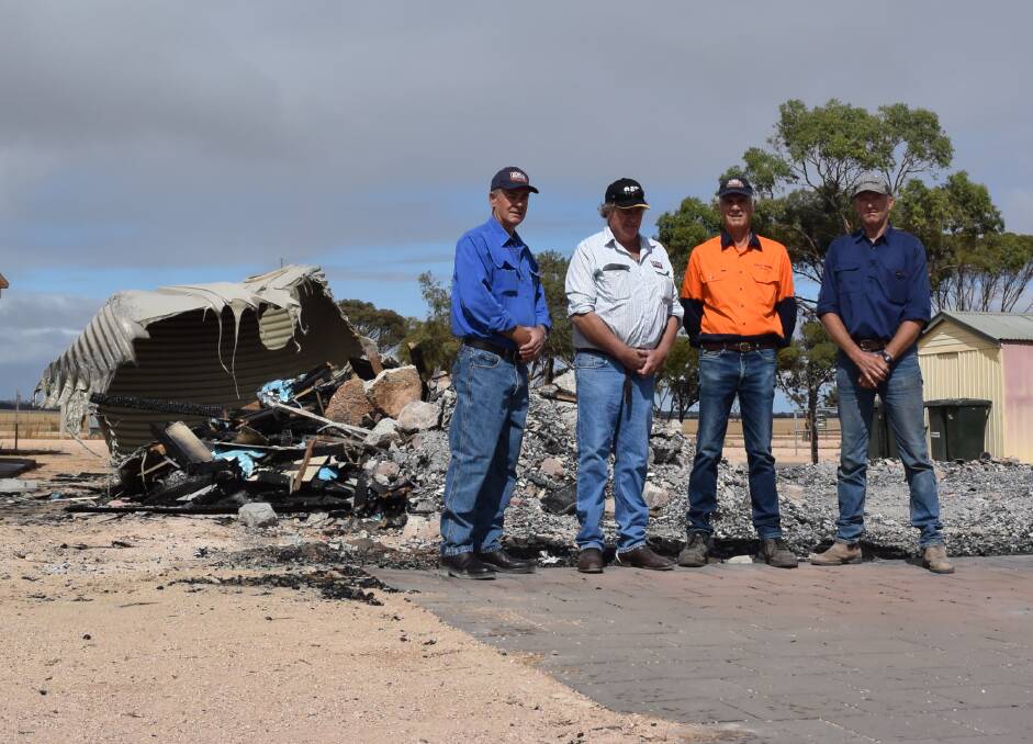 Burnt mess: Yorke Peninsula Field Days chief executive officer Peter Anderson, vice-president Martin Kenny, president Bruce Philbey and Arthurton ag bureau delegate Adrian Mason in front of the office remains.