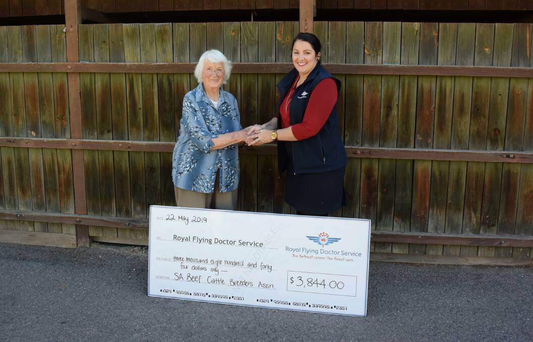 WORTHY CAUSE: Former SABCBA president Jean Evans presenting the association's remaining proceeds to RFDS community fundraising coordinator Kristen Newlyn.