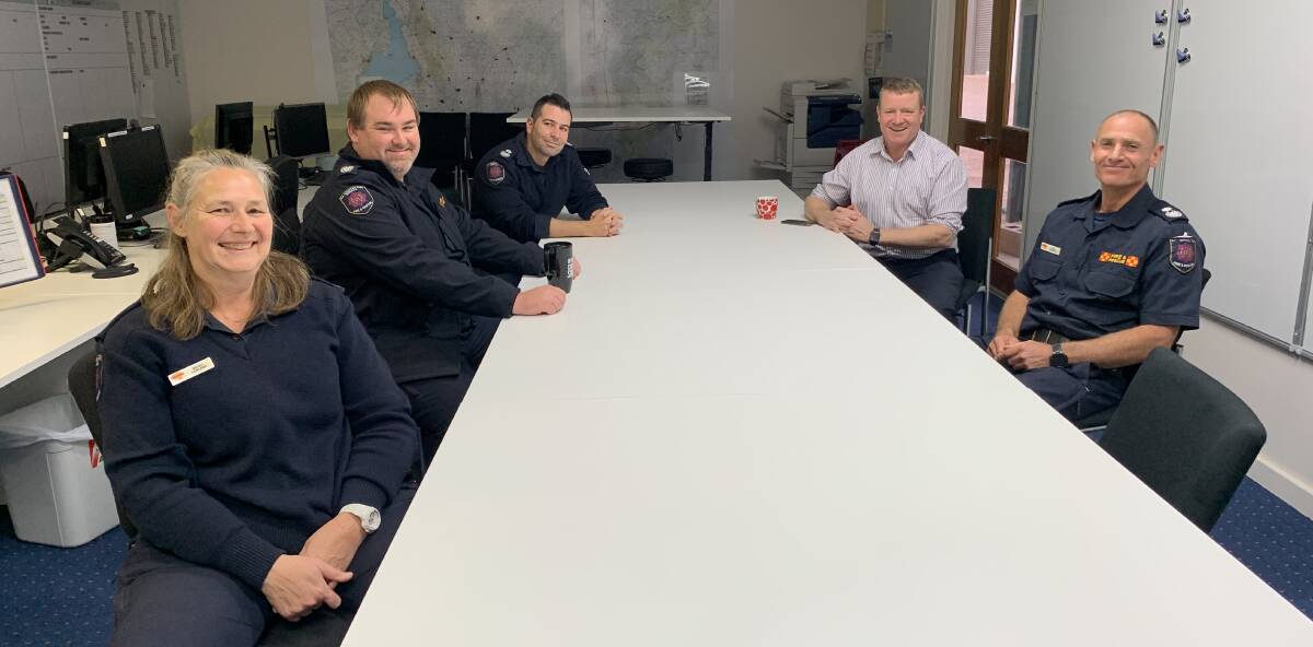 GIVING FEEDBACK: SAFECOM chief executive Dom Lane (back right) with CFS Region 4 staff and volunteers Nicoli Ackland, Quinton Kessner, Peter Ikonomopoulos, and Phil Tapscott, who are based out of Port Augusta.