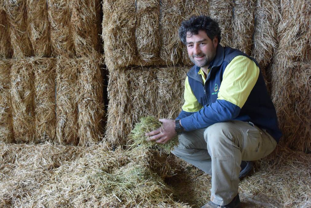 IMPENDING DECISION: Pinery cropper Kelvin Tiller, with some of last year's lentil hay, which has been sold. He said the decision to cut his lentil crop for hay this year would be price and weather dependent.