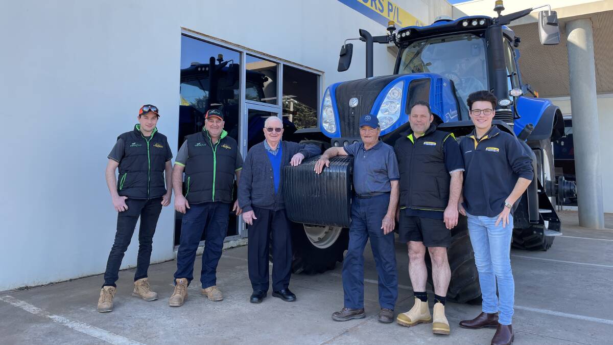 The Cecchin family receiving their New Holland T8 PLMi from the RP Motors team. Pictured are Damien, Robert and Gildo Cecchin with Roberto, Robert and Joshua Piovesan. 