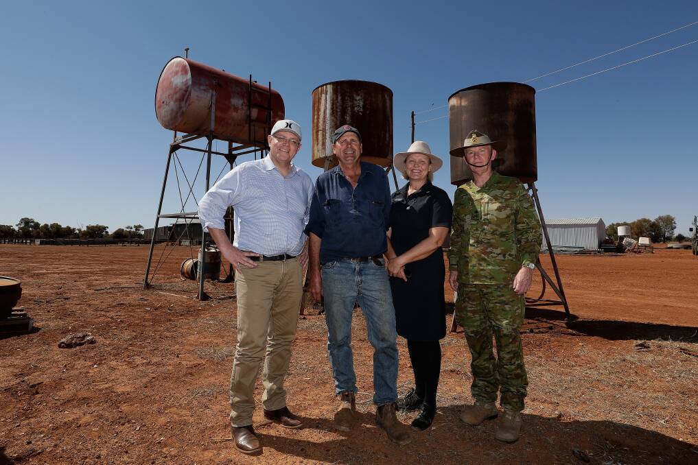 Scott Morrison, Bunginderry, QLD, graziers Stephen and Annabel Tully and Major-General Stephen Day on the Tully's property near Quilpie in August 2018. Photo Alex Ellinghausen.
