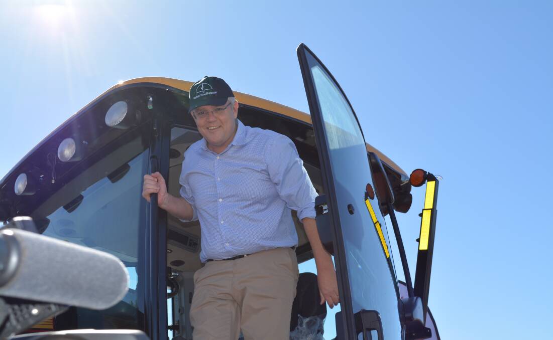 Scott Morrison on a tractor at Eumungerie, 10 kilometres north of Dubbo, NSW.