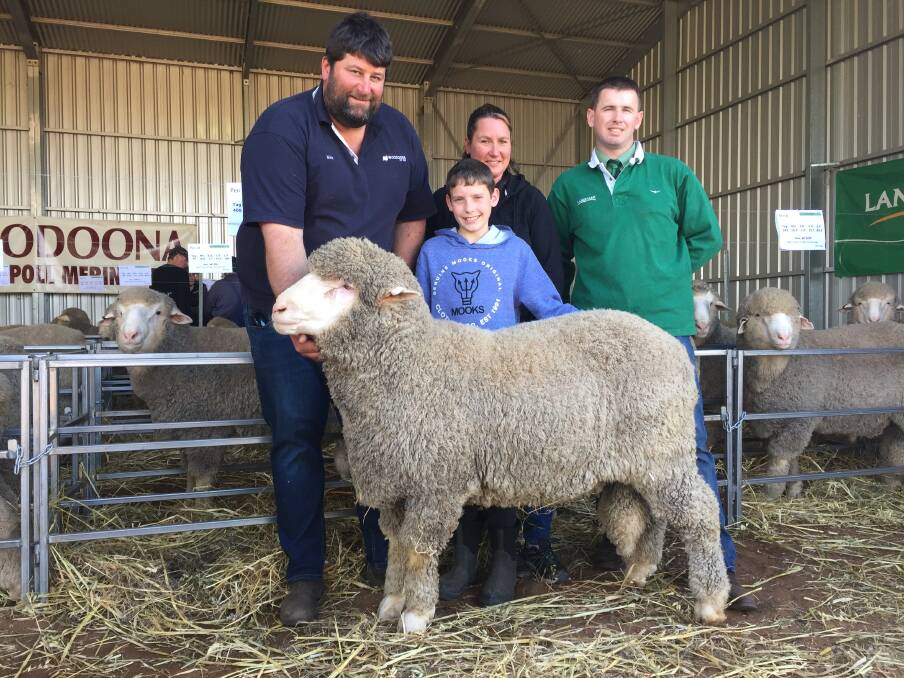 Woodoona Poll Merino Stud principal Nick Wood with Landmark Karoonda agent Michael Lawrence (Far Right) with the $4800 top price ram B235, that was sold to Anne and Ryan Simcock, Tailem Bend.  