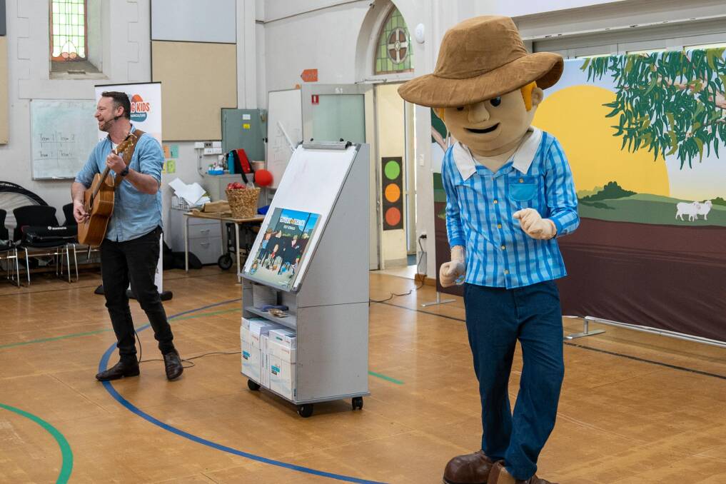 George the Farmer and Ben Hood putting on a show for the students of Goodwood Primary School as part of Educating Kids About Agriculture.