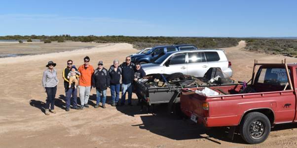 Landscape Officer Barbara Murphy with members of a Whyalla 4WD club during a saltmarsh clean-up event. 