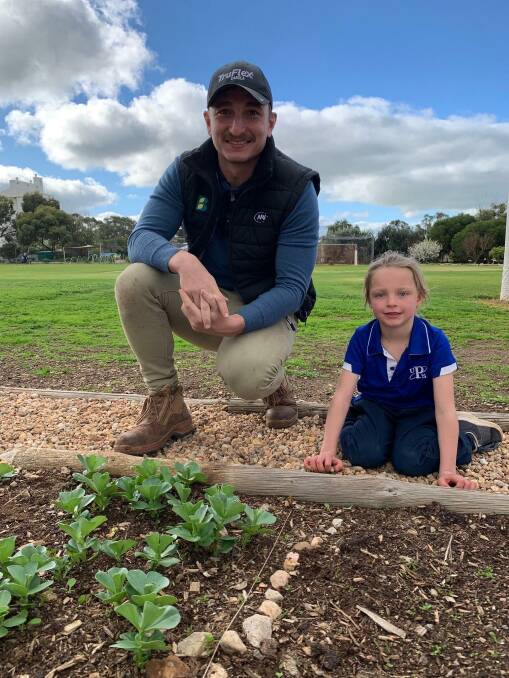 Ungarra Primary School student Alexis Boehm with Bawden's Rural Trading agronomist Luke Wilkins. Picture Supplied 