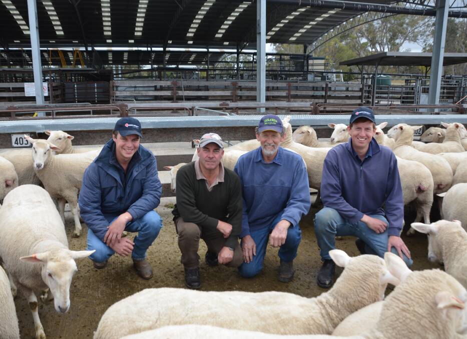 RECORD BREAKERS: Southern Australian Livestock's Dave Fraser with $402 first-cross ewe buyer Ken Atkin, Kongorong, offered by vendors David and Brody Lock, Lock-Haven, Mundulla. 