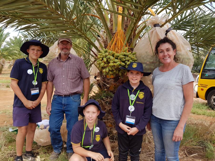 NEW IDEAS: Renmark North Primary School students with Gurra Downs date plantation owners Dave and Anita Reilly.