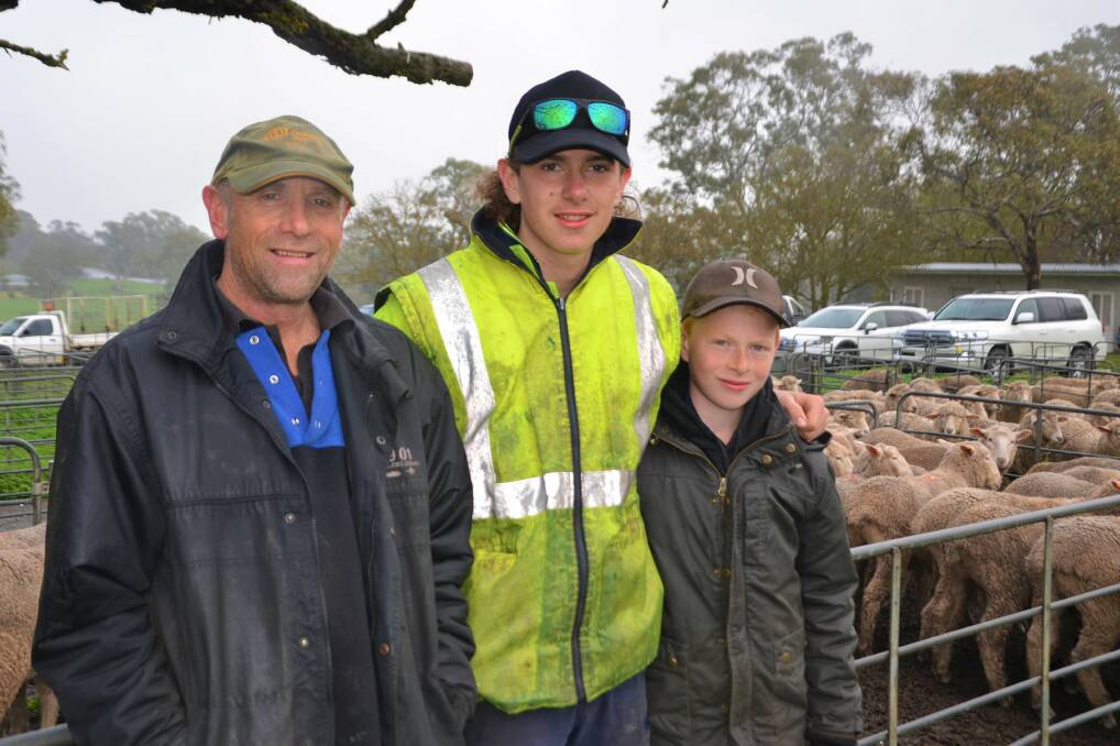 PACING PENS: Chris Tapscott, Tanunda, with his sons Sam and Jason. The Tapscotts offered 30 Merino/Border Leicester crossbred lambs at the Mount Pleasant market. 