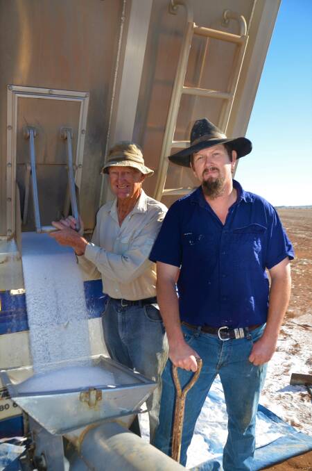 UNLOADING INPUTS: Matthew Burford and his father David spread sulphate of ammonia across paddocks at Balaklava this week in preparation for seeding in the coming weeks. 