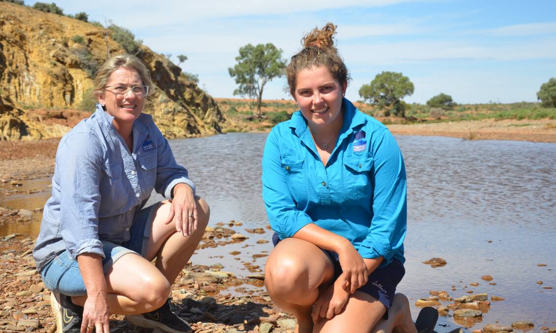 FLOWS ARRIVE: Almerta station's Shane Rowe, Cradock, and her daughter Courtney at a creek that was filled with up-stream water at the beginning of March. 