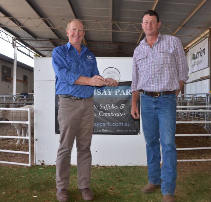 PASSION REWARDED: Ramsay Park stud principal Peter Button was presented with an Australian White Suffolk Association life membership from federal council president Anthony Hurst. 