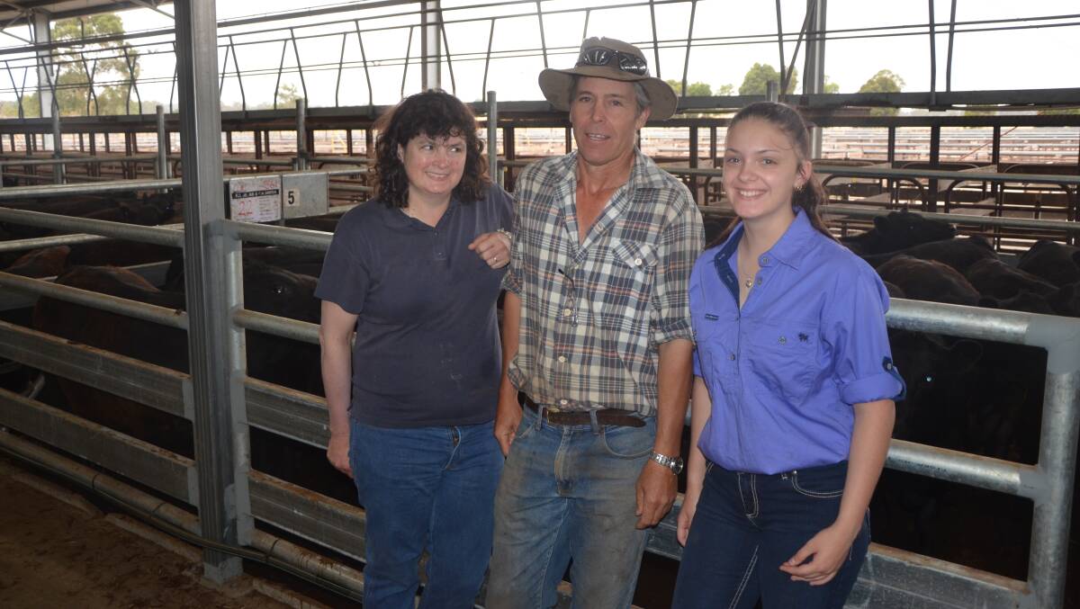 PLEASED: Vendors Carol and Alan Smith, Joanna, with their niece Bailey Villis. They received $1140 or $3.16/kg for 22 March/April-drop, Glatz Black Angus-bld heifers, av 361kg. They also sold 31 lighter weights of the same description, av 318kg, for $910 or $2.86/kg.