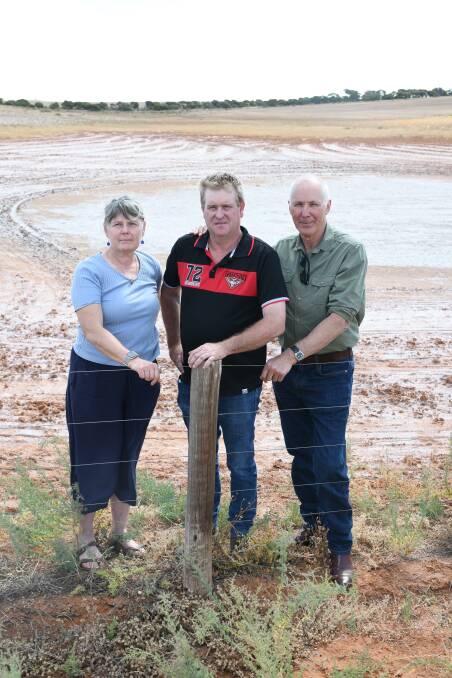 Three members of the committee representing the Noora Basin Community Working Group - Yvette Frahn, Stephen Nitschke and Gary Frahn - in front of previously arable country on the Frahns property.