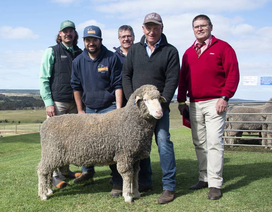 Pictured with the $3000 top-priced Poll Merino ram are Nutrien KI's Dusty Cross, Ella Matta's Jamie and Andrew Heinrich, Classings Limited's Bill Walker and Elders stud stock's Tony Wetherall.