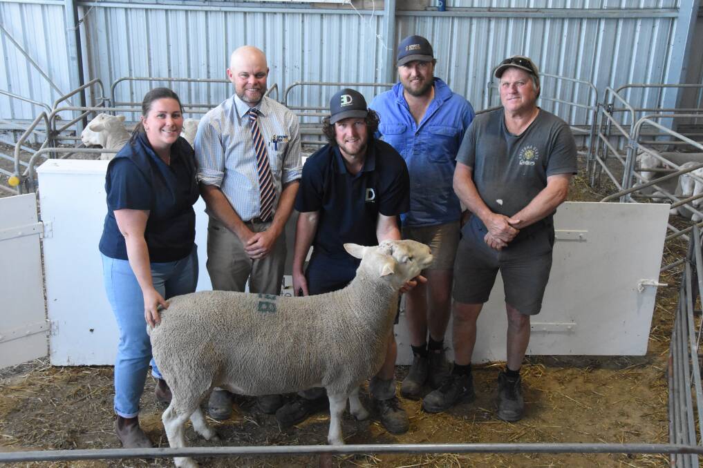 Elton Downs White Suffolk stud, Karoonda, enjoyed a strong ram sale this year, with a full clearance of 202 rams to a $1504 average. They also donated the $2200 proceeds of Lot 28 to Ronald McDonald House. Pictured with the charity ram were Elton Downs' Emily Rudiger, Spence Dix & Co's Luke Schreiber, Elton Downs' Chris Rudiger, and buyers Adrian and Brandon 'Butch' Wait, Jabuk. Picture by Liam Wormald 
