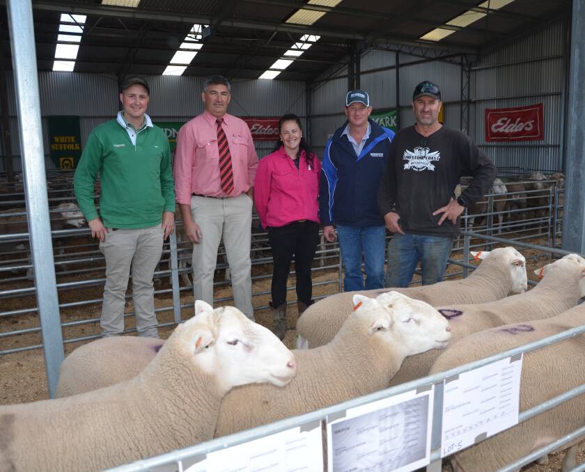 GOOD RUN: Landmark's Nick Heffernan, Elders' Laryn Gogel, local buyers Kat Williams and Greg Fisher (right), Clover Ridge, Woolumbool, and Seriston principal Anthony Hurst (second from right). Clover Ridge were active at the top end of the White Suffolk catalogue buying six rams to $3000, averaging $2450.