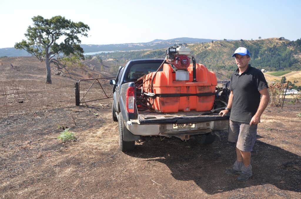 KEEPING FLAMES AT BAY: Apple grower Matthew Hannaford lost 350 apple trees, 6km of irrigation drip lines and 6.7km of fencing on his Cudlee Creek property in December's fire. He said the result would have been much worse if not for the family's farm firefighting units used to fend off flames.