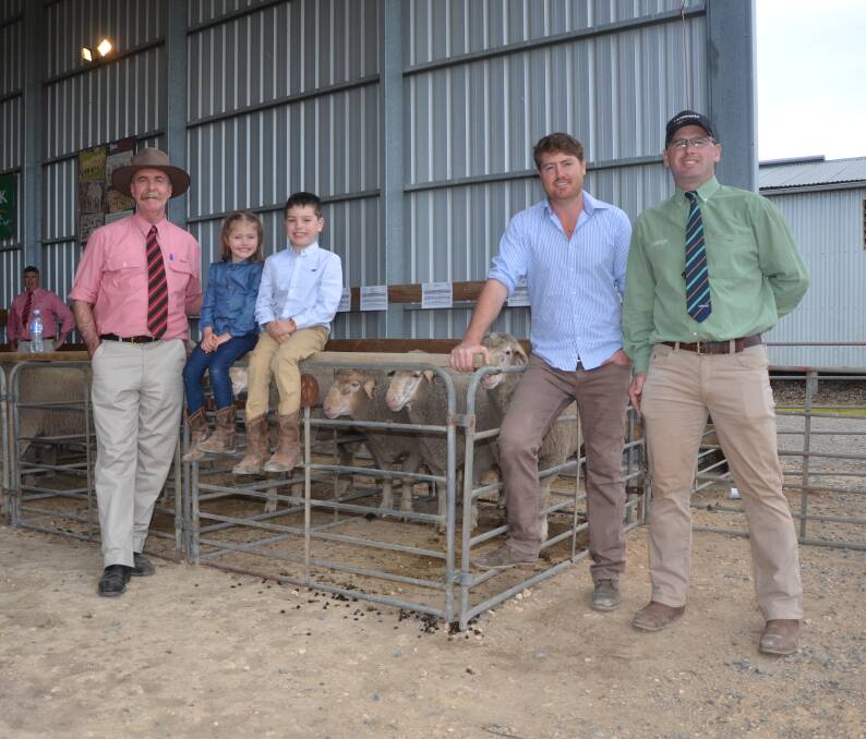 GIVING BACK: Elders Tom Penna, Mt Alma's Ella, Harry and Eric Ashby, and Landmark Tintinara's Michael Lawrence in front of the pen with the charity ram. The proceeds of $3200 were divided between Buy a Bale and the Cystic Fibrosis Foundation.