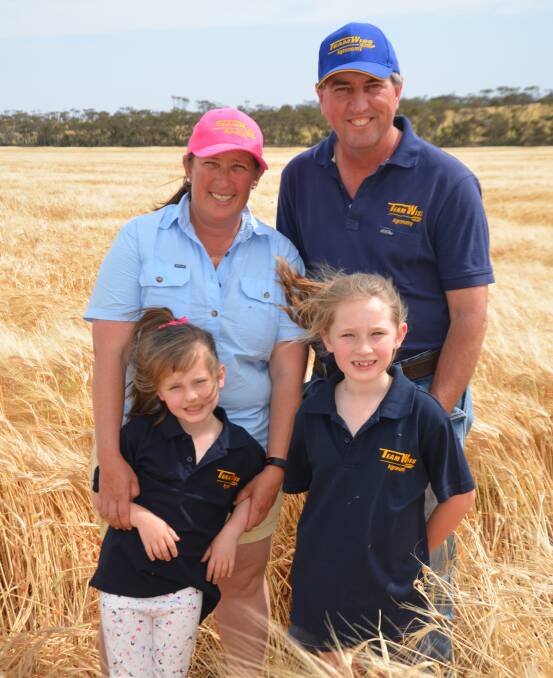 LUCKY BREAK: Cindy and Craig Wissell, Wynkie, Maitland, with their girls Zara and Maddison, in barley crop expected to yeild well this year thanks to timely rains.   