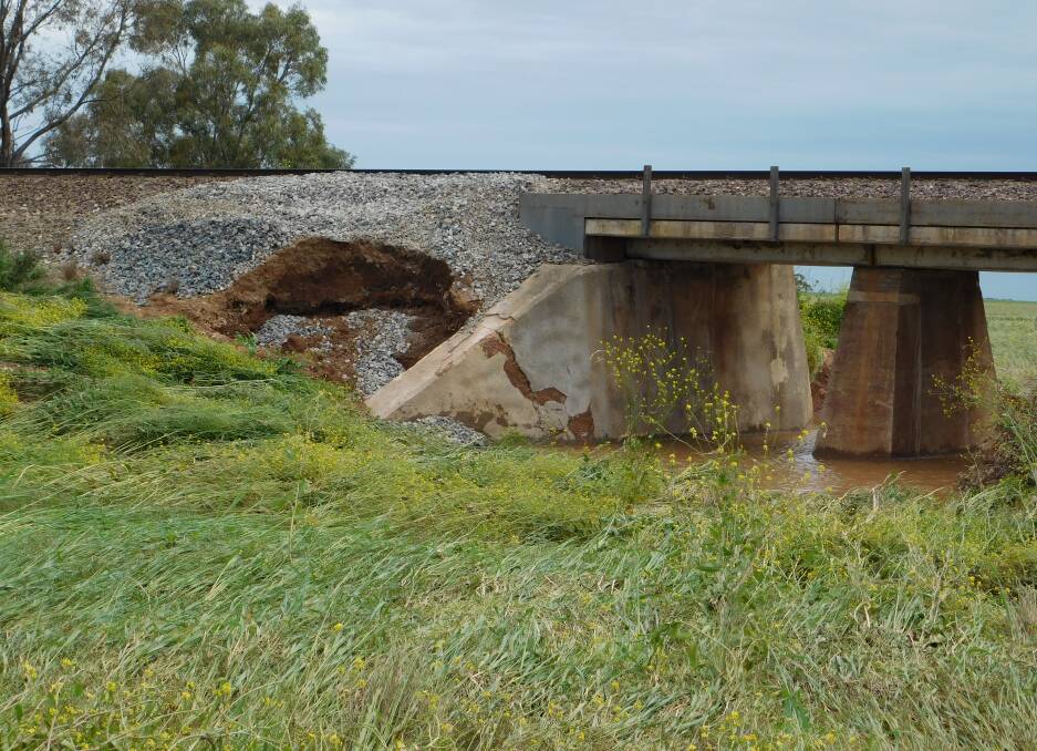 UNDERLYING DAMAGE:The flood demolished the side of the railway culverts. Locals say the damage was "patched up" by ARTC.