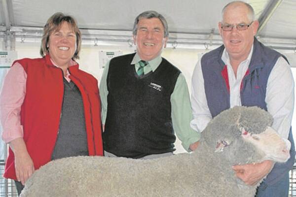 The top-price  ram at Flairdale, 102-kilograms with  a 19.9-micron ﬂ eece, was bought by  Jeff Burgess, Gulnare. With the ram  are Elders district wool manager Steph  Brooker-Jones, Landmark stud stock’s  Malcolm Scroop and Flairdale principal  Wayne Lehmann.
