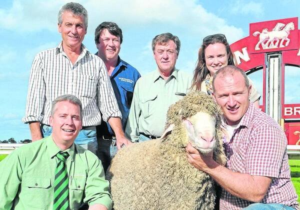 RIPPER DEAL: Peter & Marianne Wallis (right), Glenlea Park, Pinnaroo, with the $51,000 ram that set a new stud record, and became the highest priced Merino sold in SA for many years. They are pictured with Landmark stud stock auctioneer Gordon Wood, Classings Limited’s Bill Walker, underbidder and semen share holder Will Lynch, Boorana, Woorndoo, and buyer Les Hamence, Pimbena stud, Wirrulla.