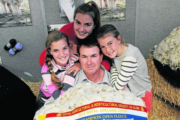 FAMILY GATHERING: Matt Ashby, North Ashrose, Gulnare, and daughters Sophie, Jessica and Emily with the stud's supreme champion fleece.