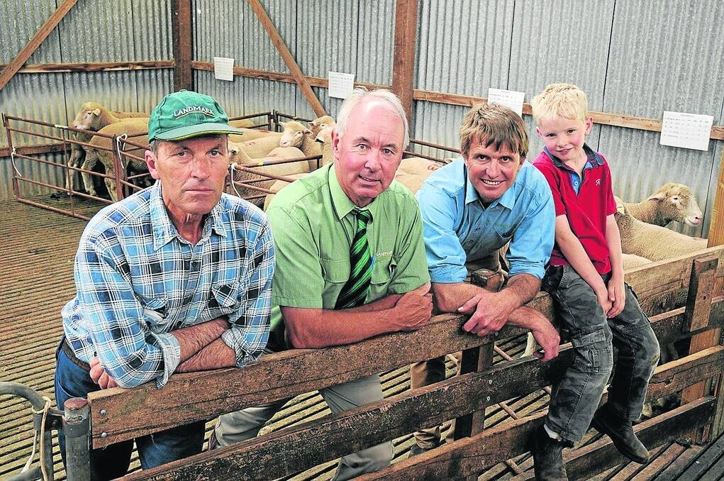 SE BUYER: Peter Heinrich, Keith, who bought six Poll Dorset rams at Corriedale Hills, is with auctioneer Landmark Strathalbyn's Richard Snoswell and Corriedale Hills principal, Brenton Lush and his son Isaac.