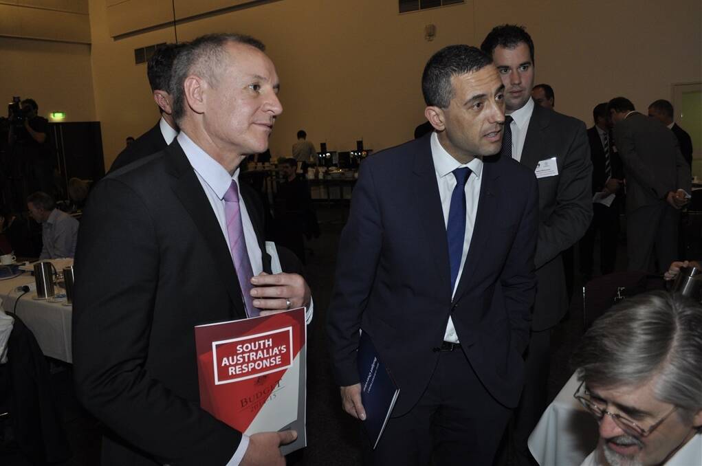 LOCK UP: Premier Jay Weatherill and Treasurer Tom Koutsantonis argue the merits of the 2014-15 state budget in the media lock-up today.