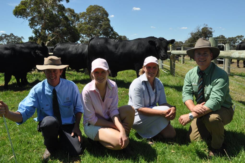  Nick and Sara Moyle and their daughter Elle, Pathfinder stud, with Landmark stud stock manager Gordon Wood and the $16,000 top-priced bull, Pathfinder Docklands J112 which sold to the Kelly family, Mooramook, Caramut, Vic.