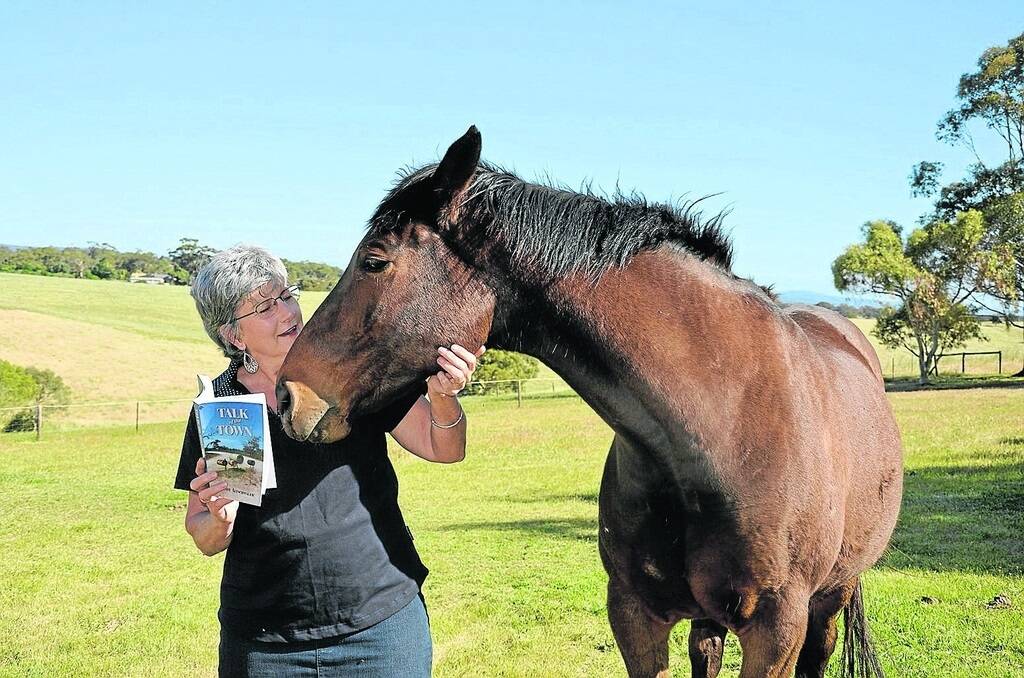 Wendy Altschwager with Hughie and a copy of her latest book Talk of the Town.