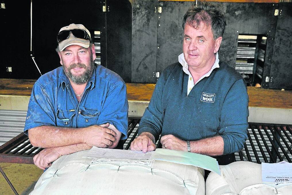 West Coast grower Paul Carey, who farms at Kaldoonera, near Cungena, and local Quality Wool marketing representative Lawrence Seal discuss the family’s Talieka Pastoral wool clip.