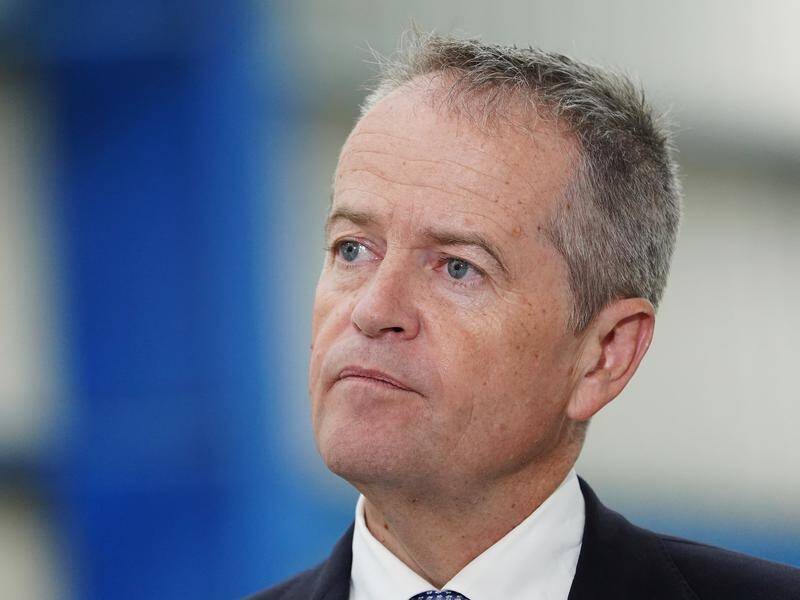 Bill Shorten has signaled a Labor government could change laws to get minimum wages lifted.