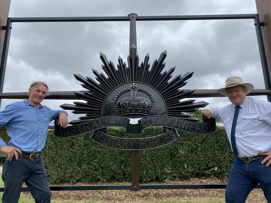 Local blacksmith Brent Cook with his rising sun sculpture commissioned to mark the centenary with Hill MP Shane Knuth.