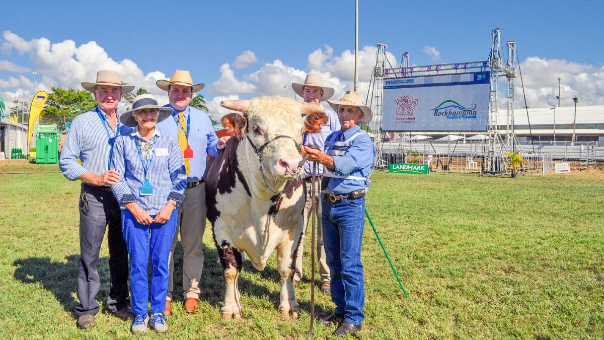 Grand champion Hereford bull Cootharaba Explicit exhibited by Ian and Ian and Anne Galloway Cootharaba Beef Genetics, Roma with judge Ben Davies judge, Andrew Donohue CEO Hereford Australia, and held by Chris Law. Picture: Jane Lowe