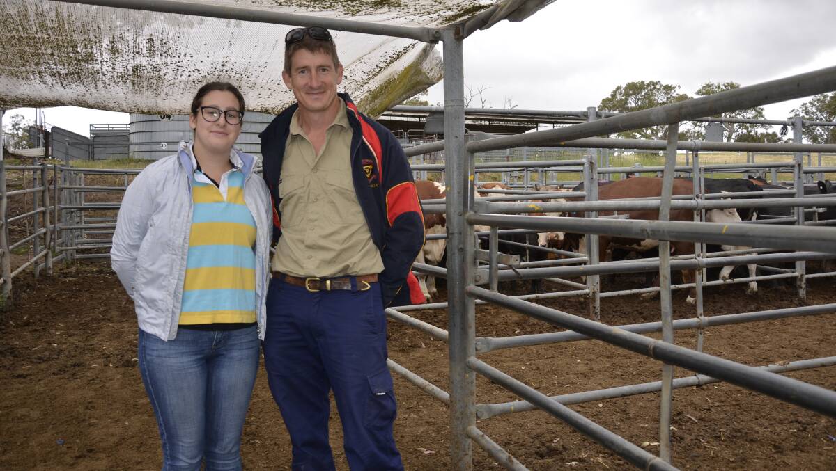 SPECIAL OUTING: Esther Fechner, Lyndoch, with her dad Aaron Fechner, looking over the cattle at the final Mount Pleasant sale for 2018.
