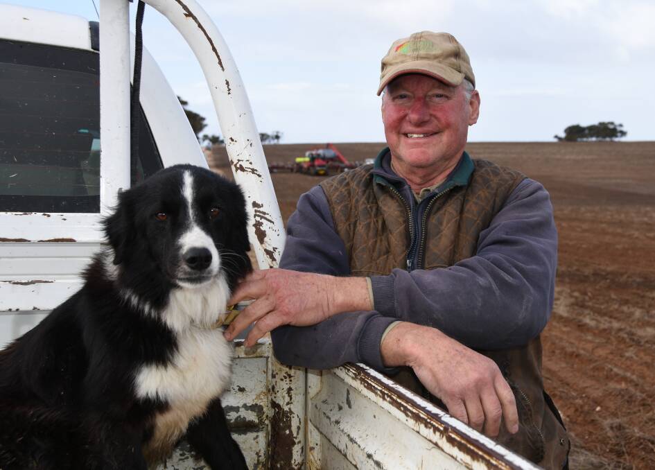 ROLL ON: Garry Hansen, Coomandook, with his Border Collie Perry, at his family's property where seeding was well under way last week.