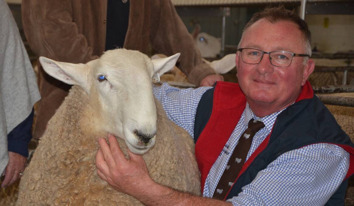 BEST HEAD: Simon Makeham, North South, Young, NSW, with the ram that won best head.