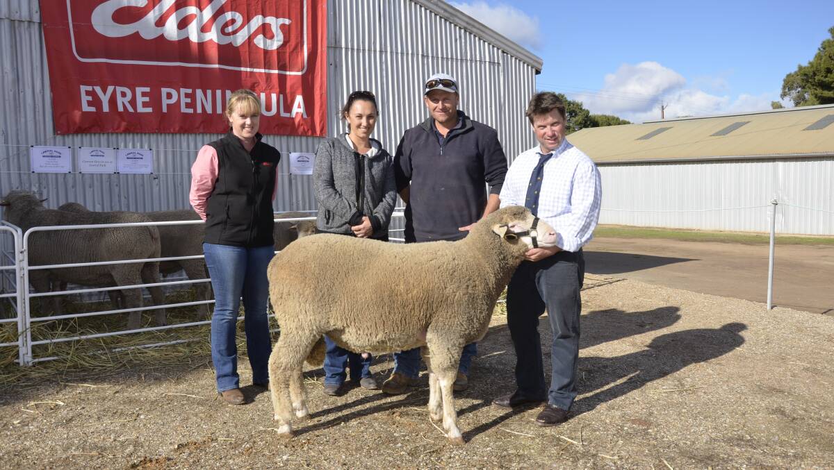 HIGHEST PRICE: With the $5000 ram were Elders EP district wool manager Claire Loveridge, buyers Laura and Jason Bates, Butler Tanks, and principal Campbell Lawrie.