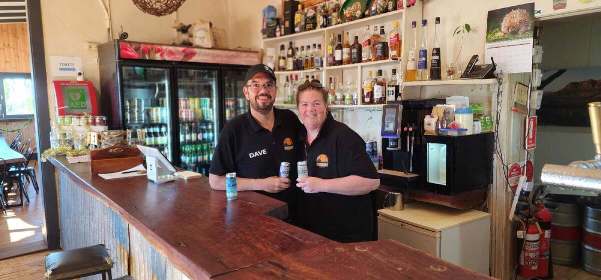 Cradock Hotel owners Dave and Amy Wallis cheers to their new lifestyle. Picture supplied.