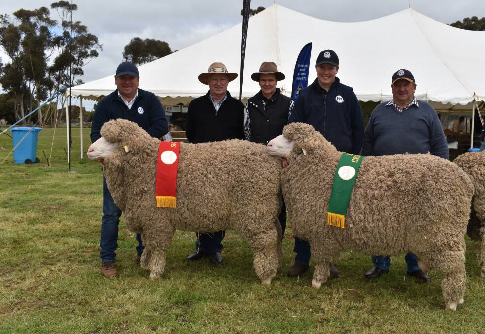 State champion ram Mulloorie 792 held by Mulloorie stud principal Paul Meyer, judges Tamaleuca Poll partners Kevin Crook and Danni Wilson, Ouyen, Vic, and state champion reserve 1453 being held by Mulloorie's Darcy Meyer and Peter Meyer. Picture by Kiara Stacey