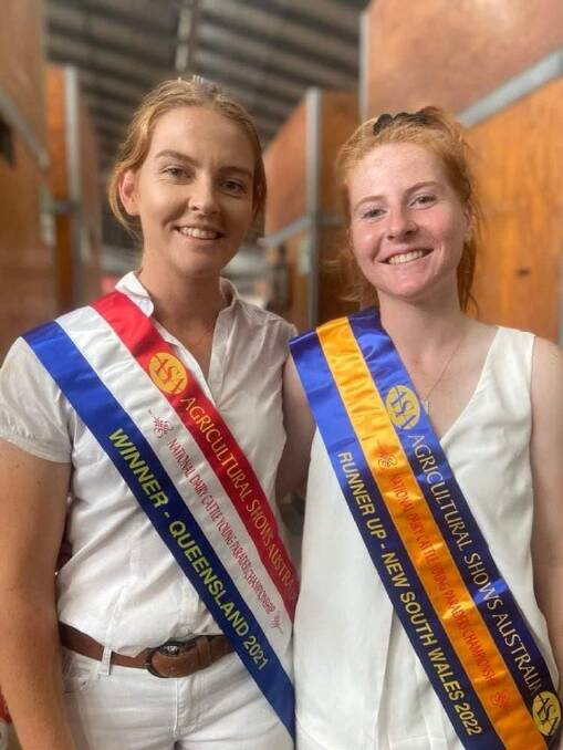 Courtney and Tegan Afford with their sashes from the National Dairy Cattle Young Paraders Championship at this years Sydney Royal Easter Show.