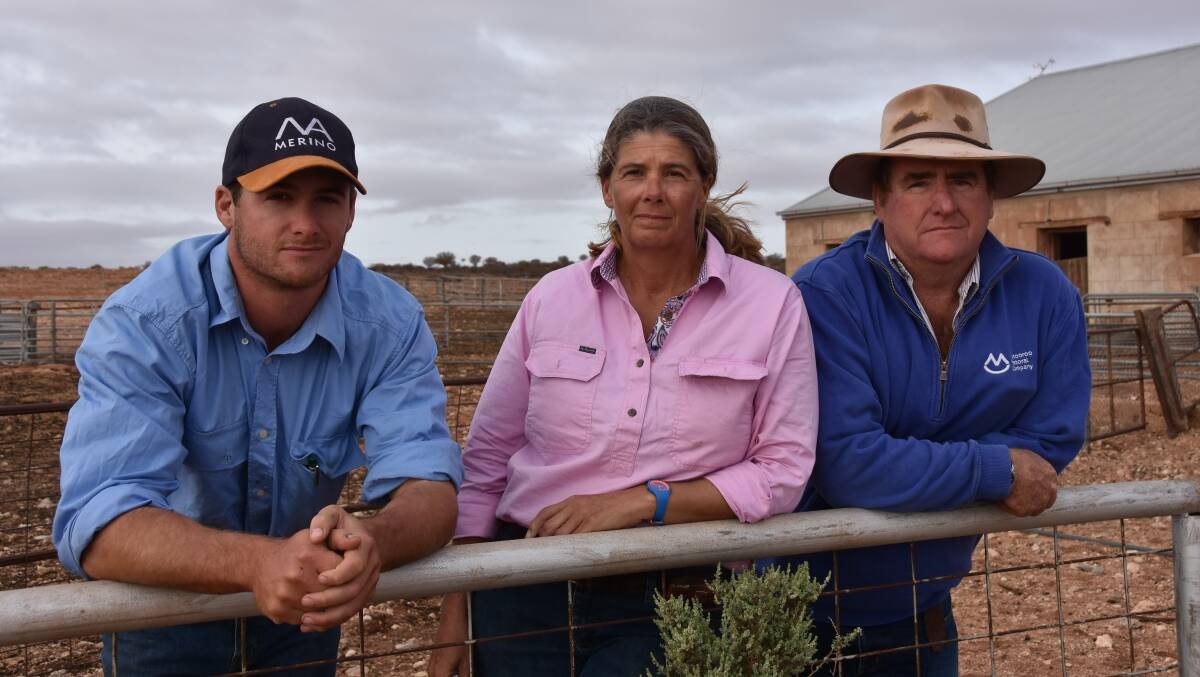 Pastoralist James Morgan (right) with his son Ed and wife Alex, says repairs to the Dog Fence are crucial.