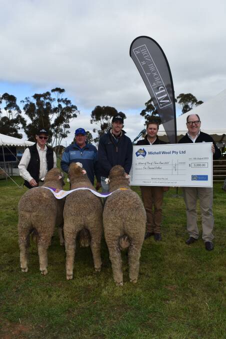 The winning pen of three were lots 2, 3 and 4 of Collinsville, held by Collinsvilles stud groom Dennis Dalla, Brooks Merino stud consultant Tony Brooks and Collinsville jackaroo Hudson Bennier with Collinsville stud principal George Millington and Michell Wool managing director Andrew Luxton. Picture by Kiara Stacey