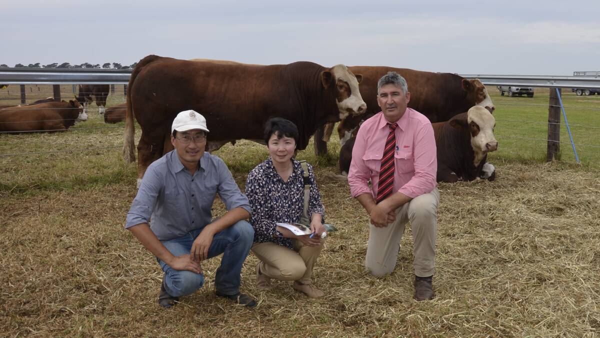 Lakeside principals Dong Zhu and Lily Xu with Elders southern livestock manager Laryn Gogel.