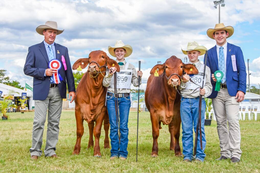 Grand champion Queenslander female, Muan Diane, with handler Amber Johnson, and reserve junior champion female, Barlyne Nancy Littleton, with handler Alex Creevey. They are joined by judges Darren Childs, Glenlands Droughtmasters, Bouldercombe, and Ben Wieland, Boonah. 
