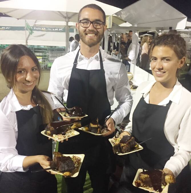 INTERNATIONAL FLAVOUR: Millaray Jorquera, Chile, Marina Gilabet, Spain, and Rhamon Freitas, Brazil, serving up beef ribs at Teys Australia's Beef 2018 cocktail party. 