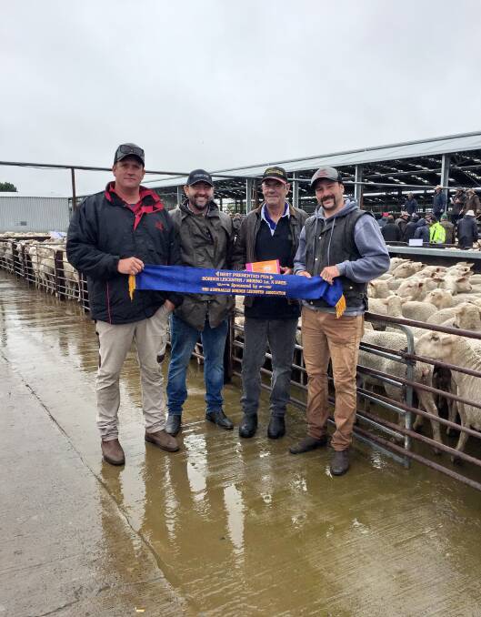 RECORD HOLDERS: : McPiggery's Adam Berwick, Martin Harvey, Paxton stud, Western Flat, Zoetis' Gary Glasson and McPiggery's Duane Simon with the blue-ribbon at the 2017 Naracoorte first-cross sale, where McPiggery set a $326 record for ewe lambs, a record they still hold.